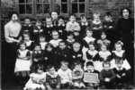 Kimpton School: Before 1920 Kimpton School Group with Miss Harkett and pupil teachers Florrie East & Annie Grey. Pupils are named