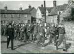 Kimpton Home Guard march past the War Memorial, with the Crescent Cottages in the background, c1940, (led by Harold Wardill)